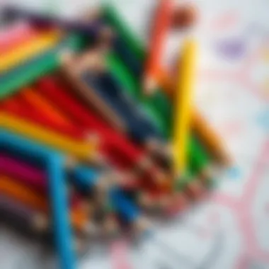 Different types of colored pencils on a drawing surface