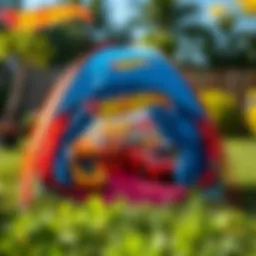 A colorful Hot Wheels tent set up in a backyard